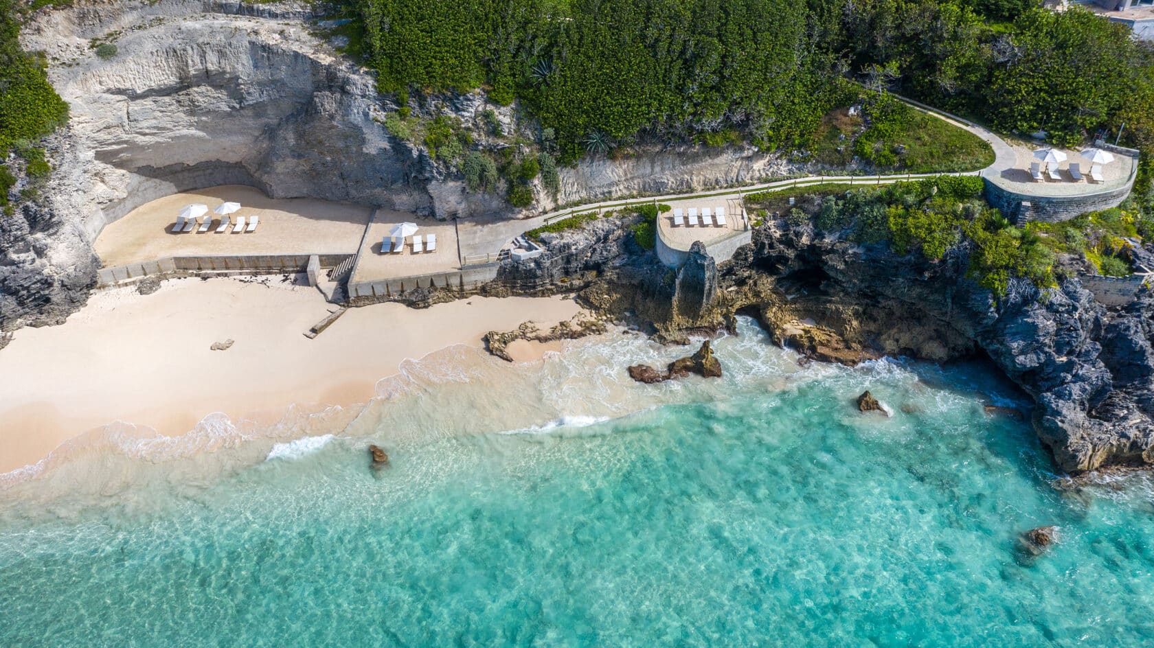 An aerial view of a beach on a cliff, perfect for those seeking bermuda vacation rentals.