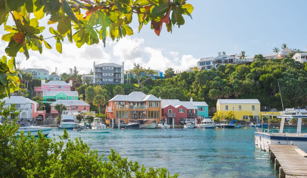 Colorful houses on the shore of a body of water in Bermuda.