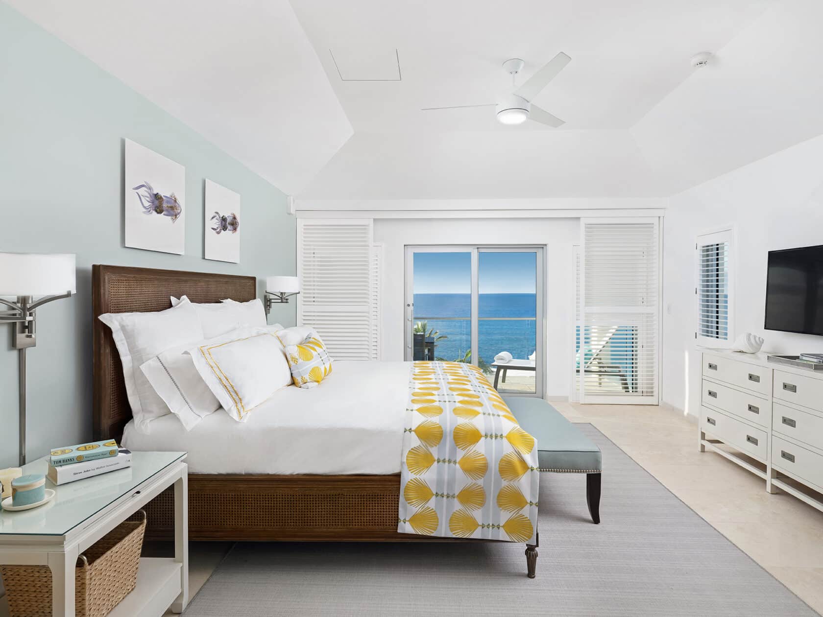 A bedroom with a view of the ocean in Bermuda residences.