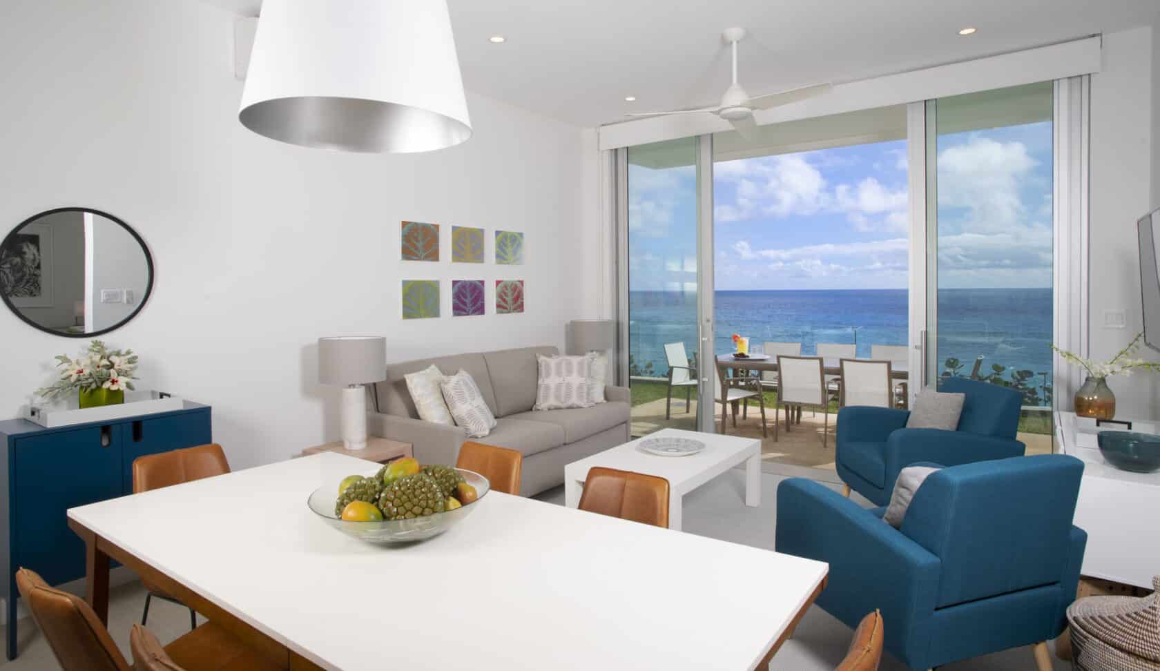 A living room with a view of the ocean, perfect for a Bermuda vacation rental or residence.